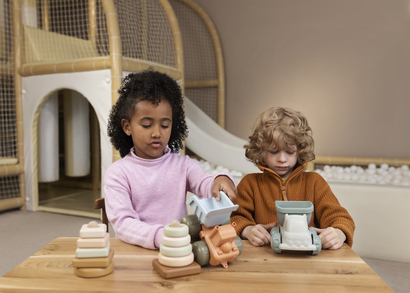 Children playing with wooden toys